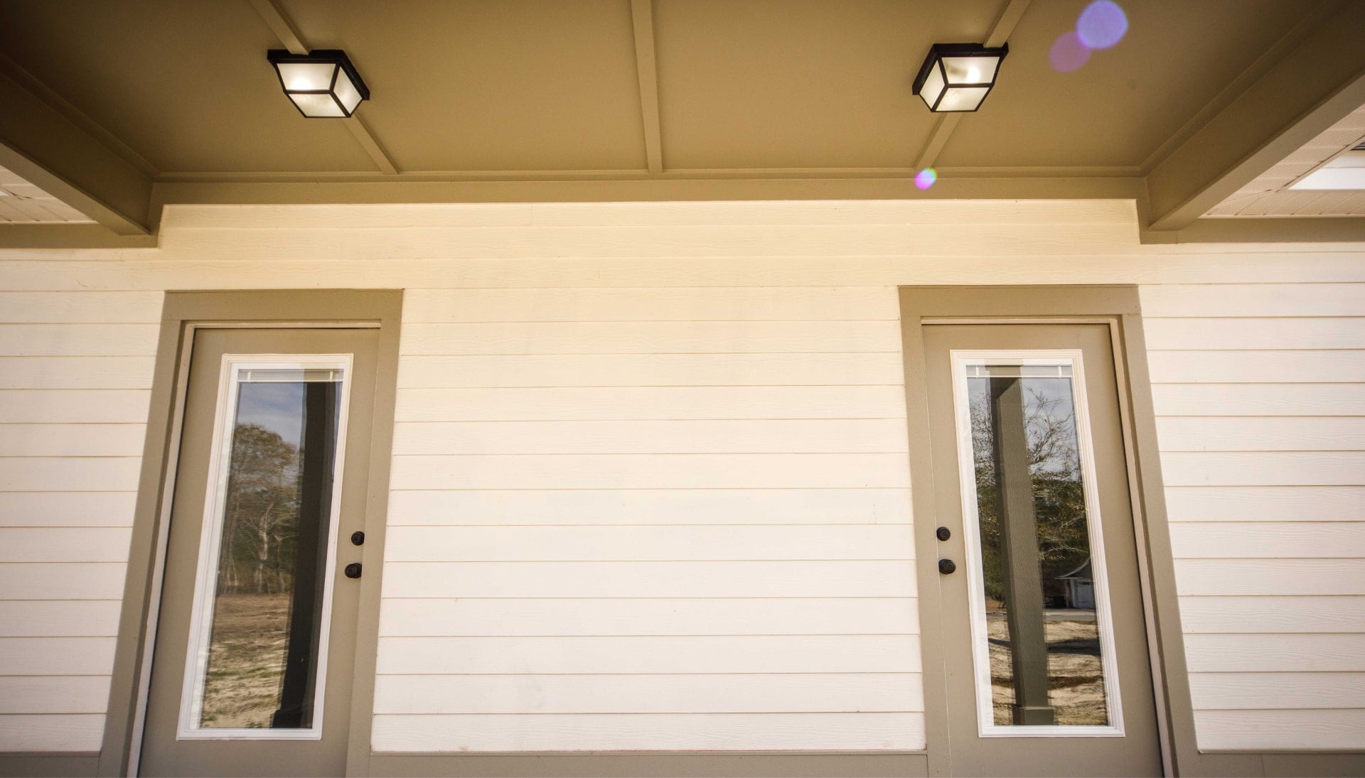 We offer siding services in Alexandria, Minnesota. Hardie plank siding installation in a front entry way.